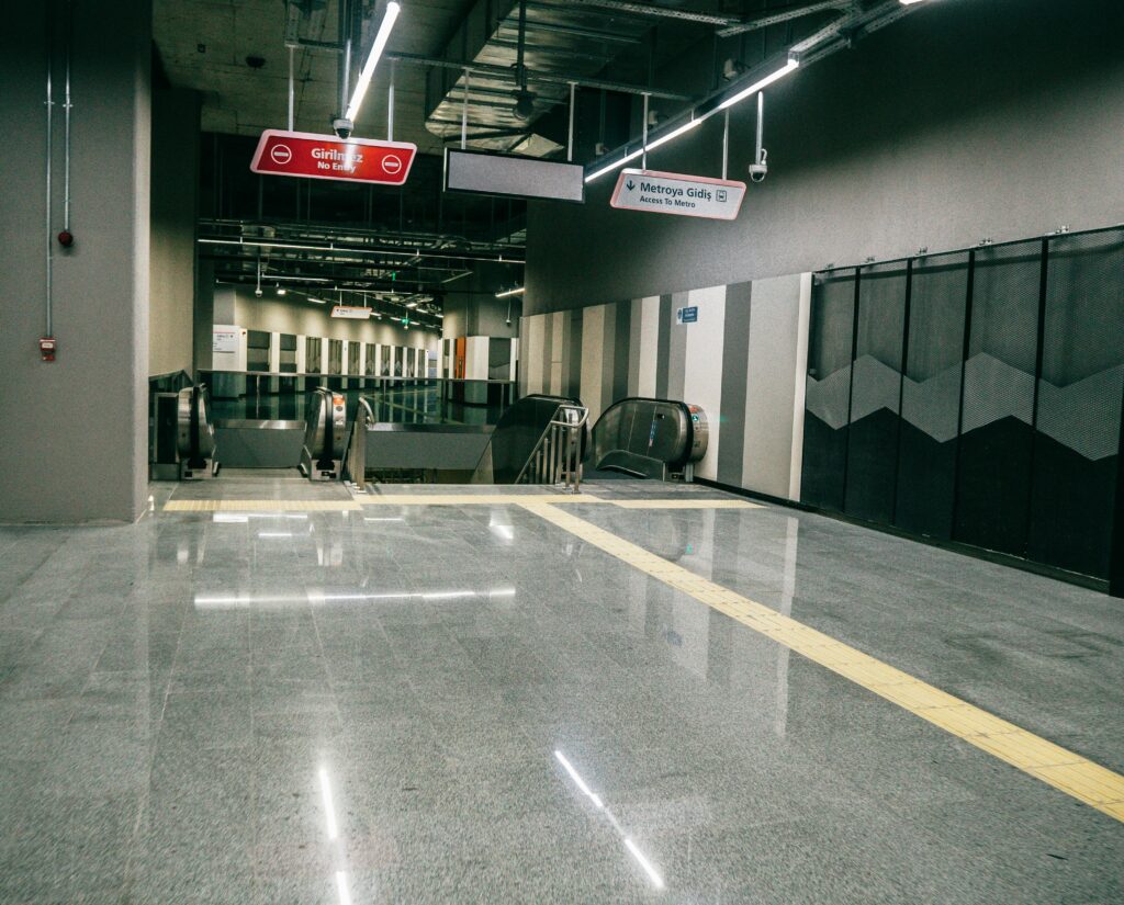 pexels-photo-7314608-7314608 Explore the sleek design of an Istanbul metro station, featuring modern architecture and escalators.